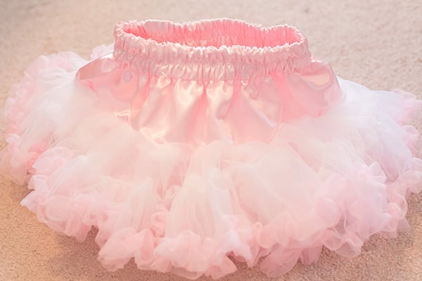 This is a chiffon DIY tutu skirt that is a DIY layered tutu pettiskirt that any girl will love. All you need is a sewing machine. It's super easy to make. This chiffon tutu dress is any little girl's dream!