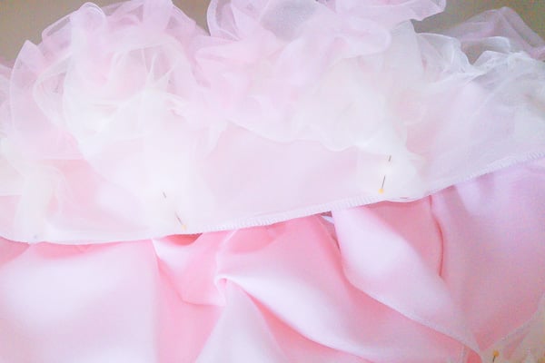 This is a chiffon DIY tutu skirt that is a DIY layered tutu pettiskirt that any girl will love. All you need is a sewing machine. It's super easy to make. This chiffon tutu dress is any little girl's dream!