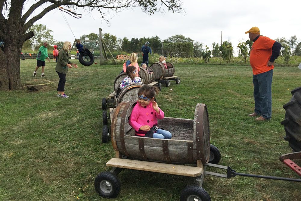 kids in barrel car