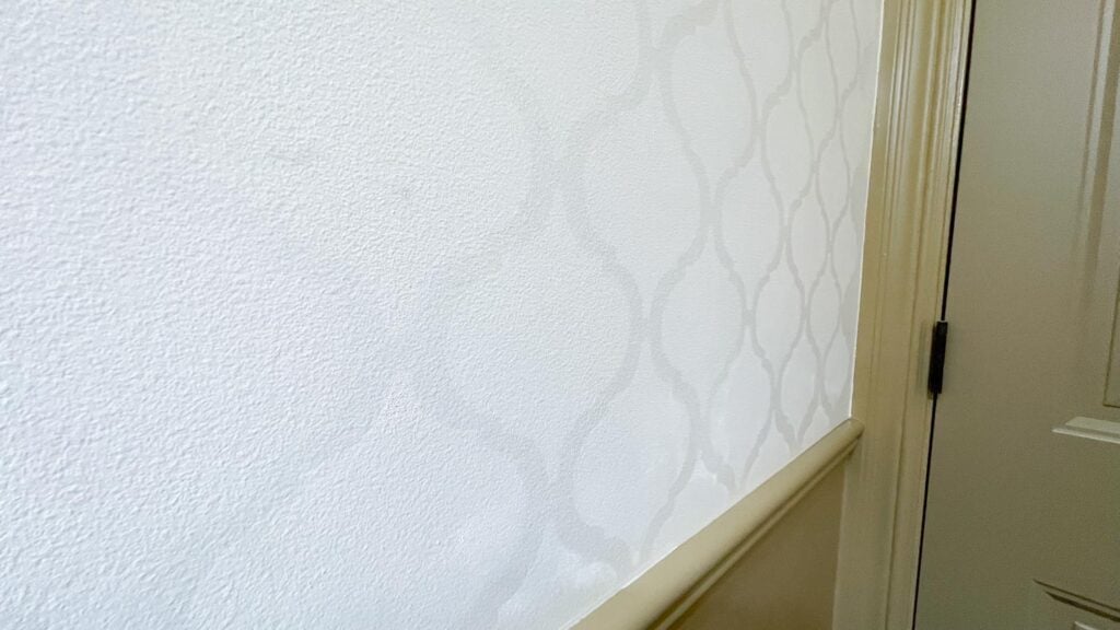 diy wall pattern paint with same color different sheen close up of egg shell and semigloss paint