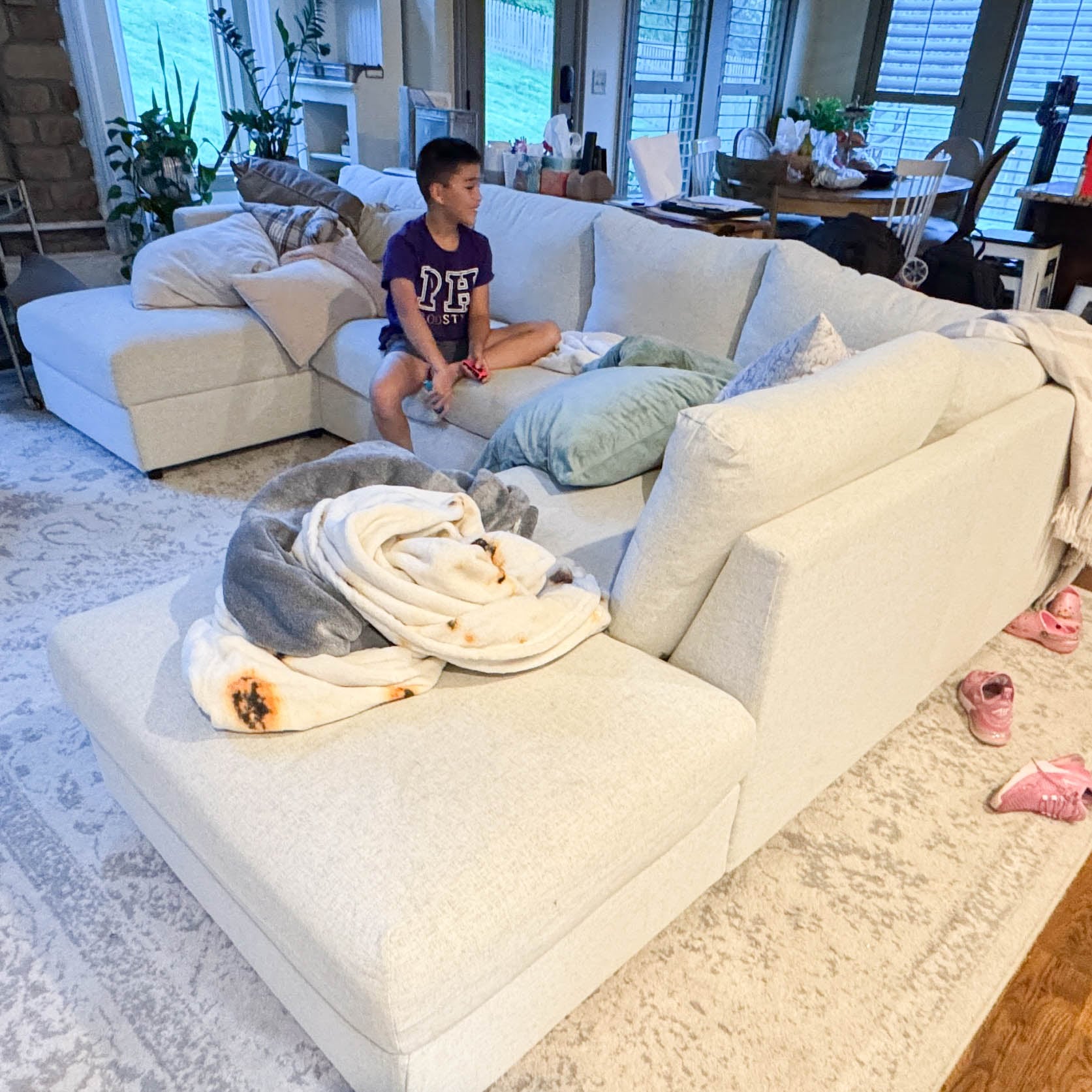 IKEA Finnala sectional seen from above with kids, adults, and cat showing real-life family seating